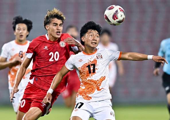 LEBANON v BHUTAN-AFC ASIAN CUP 2027 QUALIFIER THIRD ROUND Samy Merheg (L) of Lebanon and Kelzang Jigme of Bhutan in action during the AFC Asian Cup 2027 Qualifier third round Group B match between Lebanon and Bhutan at Grand Hamad Stadium in Doha, Qatar, on October 9, 2025. DOHA Qatar Copyright: xNOUSHADx