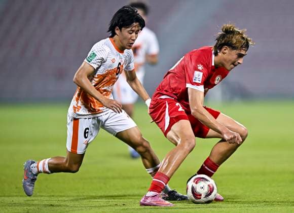 LEBANON v BHUTAN-AFC ASIAN CUP 2027 QUALIFIER THIRD ROUND Samy Merheg (R) of Lebanon and Jignam Seltob Dorji of Bhutan in action during the AFC Asian Cup 2027 Qualifier third round Group B match between Lebanon and Bhutan at Grand Hamad Stadium in Doha, Qatar, on October 9, 2025. DOHA Qatar Copyright: xNOUSHADx