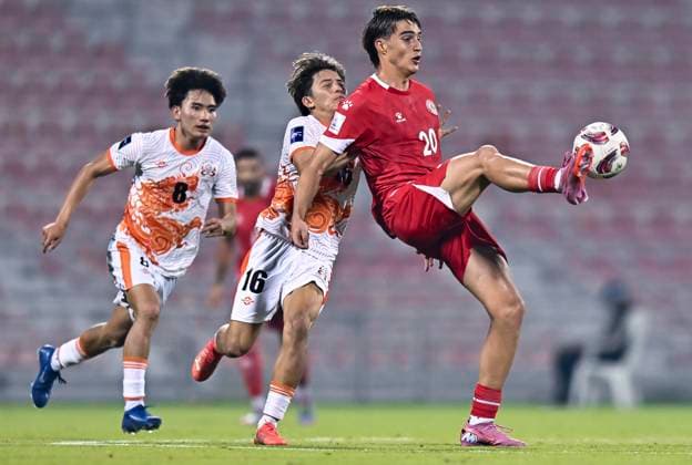 LEBANON v BHUTAN-AFC ASIAN CUP 2027 QUALIFIER THIRD ROUND Samy Merheg (L) of Lebanon and Tshelthrim Namgyel of Bhutan in action during the AFC Asian Cup 2027 Qualifier third round Group B match between Lebanon and Bhutan at Grand Hamad Stadium in Doha, Qatar, on October 9, 2025. DOHA Qatar Copyright: xNOUSHADx