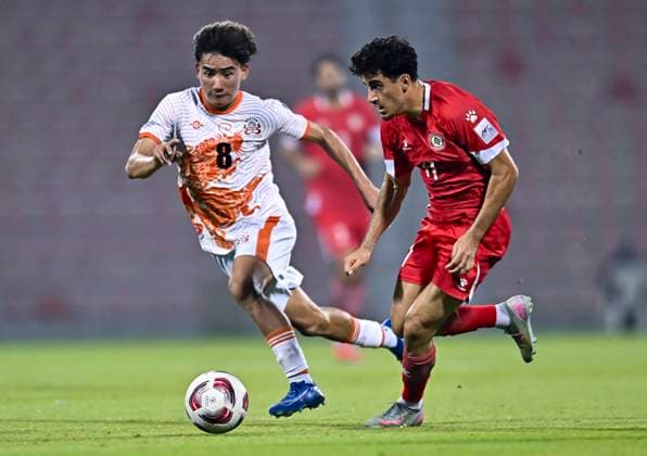 LEBANON v BHUTAN-AFC ASIAN CUP 2027 QUALIFIER THIRD ROUND Husseyn Chakroun (R) of Lebanon and Pema Zangpo of Bhutan in action during the AFC Asian Cup 2027 Qualifier third round Group B match between Lebanon and Bhutan at Grand Hamad Stadium in Doha, Qatar, on October 9, 2025. DOHA Qatar Copyright: xNOUSHADx
