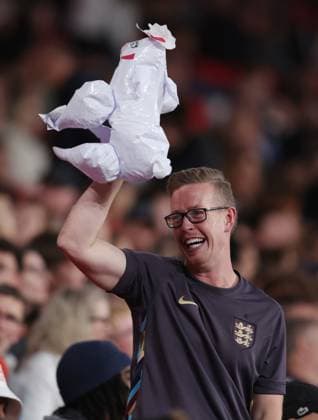 London, England, 9th October 2025. A England fan holds up an inflatable sheep towards the Welsh fans during the England vs Wales International Friendly, Länderspiel, Nationalmannschaft match at Wembley Stadium, London. Picture credit should read: Paul Terry Sportimage EDITORIAL USE ONLY. No use with unauthorised audio, video, data, fixture lists, club league logos or live services. Online in-match use limited to 120 images, no video emulation. No use in betting, games or single club league player publications. SPI_034_PT_Eng_Wal SPI-4207-0082