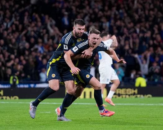 Lewis Ferguson of Scotland is grabbed by Grant Hanley of Scotland as he celebrates scoring to give Scotland a 2-1 lead. Scotland v Greece, FIFA 2026 World Cup Qualifying, Group C, Football, Hampden Park, Glasgow, Scotland, UK - 09 Oct 2025Glasgow Hampden Park United Kingdom EDITORIAL USE ONLY No use with unauthorised audio, video, data, fixture lists, club league logos or live services. Online in-match use limited to 120 images, no video emulation. No use in betting, games or single club league player publications.  Copyright: xStuartxWallace Shutterstockx 15522896co