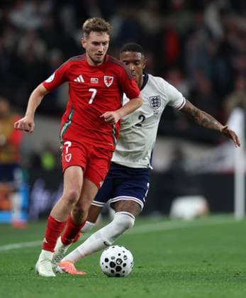 David Brooks of Wales with Ezri Konsa of England England v Wales - Alzheimer s Society at Wembley Stadium, London. UK. 9 OCT 2025Wembley Wembley Stadium London United Kingdom EDITORIAL USE ONLY No use with unauthorised audio, video, data, fixture lists (outside the EU), club league logos or live services. Online in-match use limited to 45 images (+15 in extra time). No use to emulate moving images. No use in betting, games or  Copyright: xJASONPIX Shutterstockx 15526626gl