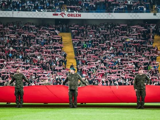 October 9, 2025, Chorzow, Poland: Polish servicemen fold Polish flag ahead of the friendly match between Poland and New Zealand at Silesia Stadium. Final score; Poland wins 1:0. Chorzow Poland - ZUMAs197 20251009_aaa_s197_388 Copyright: xDominikaxZarzyckax