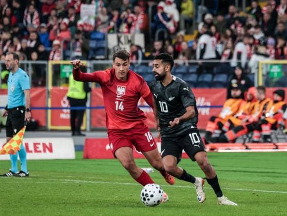 October 9, 2025, Chorzow, Poland: Polish football player Jakub Kiwor and Sarpreet Singh of New Zealand seen in action during the friendly match between Poland and New Zealand at Silesia Stadium. Final score; Poland wins 1:0. Chorzow Poland - ZUMAs197 20251009_aaa_s197_393 Copyright: xDominikaxZarzyckax