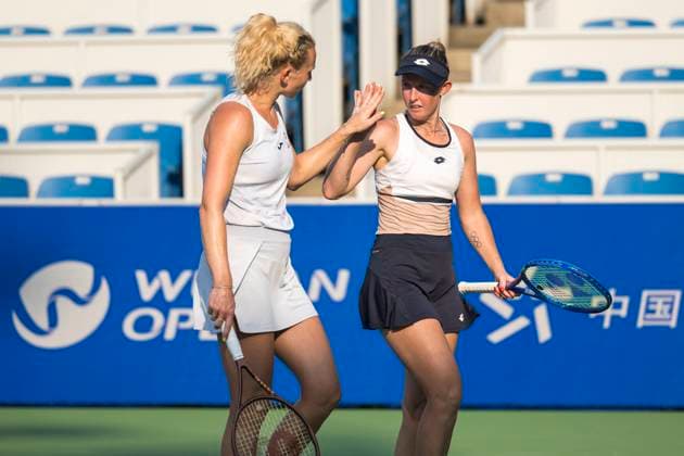 (251010) -- WUHAN, Oct. 10, 2025 -- Storm Hunter (R) Katerina Siniakova celebrate during the women s doubles quarterfinal between Chan Hao-Ching (Chinese Taipei) Jiang Xinyu (China) and Storm Hunter (Australia) Katerina Siniakova (the Czech Republic) at the 2025 Wuhan Open tennis tournament in Wuhan, central China s Hubei Province, Oct. 10, 2025. ) (SP)CHINA-WUHAN-TENNIS-WUHAN OPEN-WOMEN S DOUBLES-QUARTERFINAL (CN) WuxZhizun 