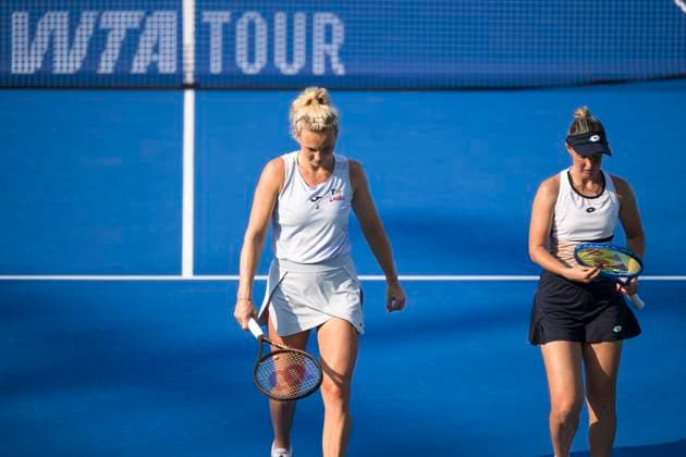 (251010) -- WUHAN, Oct. 10, 2025 -- Storm Hunter (R) Katerina Siniakova react during the women s doubles quarterfinal between Chan Hao-Ching (Chinese Taipei) Jiang Xinyu (China) and Storm Hunter (Australia) Katerina Siniakova (the Czech Republic) at the 2025 Wuhan Open tennis tournament in Wuhan, central China s Hubei Province, Oct. 10, 2025. ) (SP)CHINA-WUHAN-TENNIS-WUHAN OPEN-WOMEN S DOUBLES-QUARTERFINAL (CN) WuxZhizun 