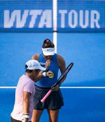 (251010) -- WUHAN, Oct. 10, 2025 -- Chan Hao-Ching (R) Jiang Xinyu communicate with each other during the women s doubles quarterfinal between Chan Hao-Ching (Chinese Taipei) Jiang Xinyu (China) and Storm Hunter (Australia) Katerina Siniakova (the Czech Republic) at the 2025 Wuhan Open tennis tournament in Wuhan, central China s Hubei Province, Oct. 10, 2025. ) (SP)CHINA-WUHAN-TENNIS-WUHAN OPEN-WOMEN S DOUBLES-QUARTERFINAL (CN) WuxZhizun 