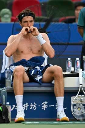 (251010) -- SHANGHAI, Oct. 10, 2025 -- Arthur Rinderknech of France takes a break as he competes against Felix Auger-Aliassime of Canada during the men s singles quarterfinal at the ATP, Tennis Herren World Tour Shanghai Masters tennis tournament in Shanghai, east China, Oct. 10, 2025. ) (SP)CHINA-SHANGHAI-TENNIS-ATP TOUR-SHANGHAI MASTERS-MEN S SINGLES (CN) ChenxHaoming 