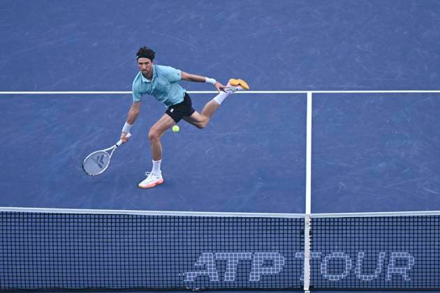 (251010) -- SHANGHAI, Oct. 10, 2025 -- Arthur Rinderknech of France hits a return to Felix Auger-Aliassime of Canada during the men s singles quarterfinal at the ATP, Tennis Herren World Tour Shanghai Masters tennis tournament in Shanghai, east China, Oct. 10, 2025. ) (SP)CHINA-SHANGHAI-TENNIS-ATP TOUR-SHANGHAI MASTERS-MEN S SINGLES (CN) ChenxHaoming 