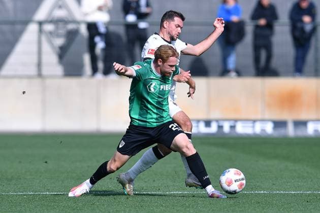 Soccer test match Borussia Mönchengladbach SC Preußen Münster on 10 10 2025 at the FohlenPlatz in Mönchengladbach Luca Bolay Münster , front Kevin Stöger Mönchengladbach , back xRx