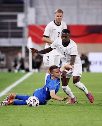 Germany Greece U21 European Championship Qualification Jena, 10 10 2025, Ernst Abbe Sportfeld, Soccer, International , U 21 Junior European Championship Qualification , Germany vs Greece , In the picture from left Stavros Pnevmonidis 7, Greece , Noel Aseko 8, Germany , Leandro Morgalla 2, Germany , For journalistic use only DFB UEFA regulations prohibit any use of photographs as image sequences and or quasi video , Picture Point