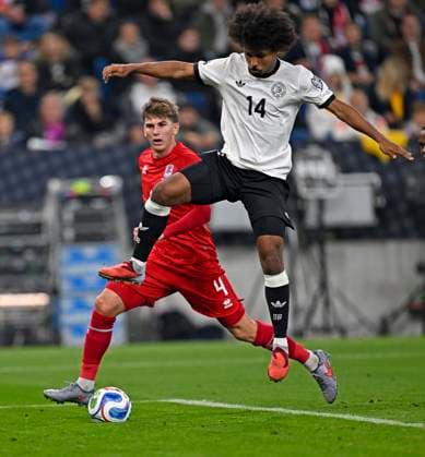 10 10 2025, Football World Cup Qualification Europe 2025 26, Matchday 7, Germany Luxembourg, in the PreZero Arena Sinsheim v l Florian Bohnert Luxembourg v Karim Adeyemi Germany