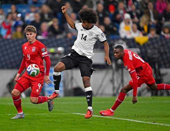 10 10 2025, Football World Cup Qualification Europe 2025 26, Matchday 7, Germany Luxembourg, in the PreZero Arena Sinsheim f l Florian Bohnert Luxembourg , Karim Adeyemi Germany and Christopher Martins Luxembourg