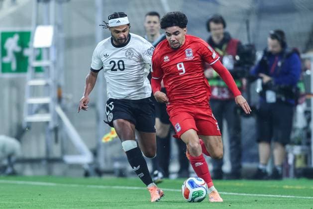 Soccer World Cup Qualification Germany Luxembourg on 10 10 2025 at the PreZero Arena in Sinsheim Serge Gnabry Germany , left Aiman Dardari Luxembourg , right DFB regulations prohibit any use of photographs as image sequences and or quasi video xJRx