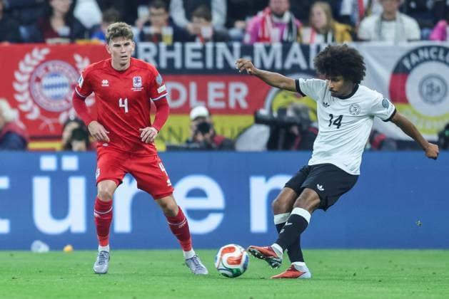 Soccer World Cup Qualification Germany Luxembourg on 10 10 2025 at the PreZero Arena in Sinsheim Florian Bohnert Luxembourg , left Karim Adeyemi Germany , right DFB regulations prohibit any use of photographs as image sequences and or quasi video xJRx