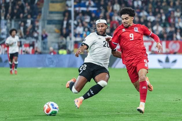 Soccer World Cup Qualification Germany Luxembourg on 10 10 2025 at the PreZero Arena in Sinsheim Serge Gnabry Germany , left Aiman Dardari Luxembourg , right DFB regulations prohibit any use of photographs as image sequences and or quasi video xJRx