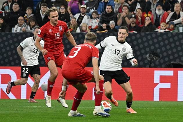 10 10 2025, xsltx, Football World Cup Qualification 2026, Germany Luxembourg v l Mathias Olesen Luxembourg Enes Mahmutovic Luxembourg Florian Wirtz German National Football Team DFB Zweikampf, Aktion, action, battle for the ball DFL DFB REGULATIONS PROHIBIT ANY USE OF PHOTOGRAPHS as IMAGE SEQUENCES and or QUASI VIDEO Sinsheim