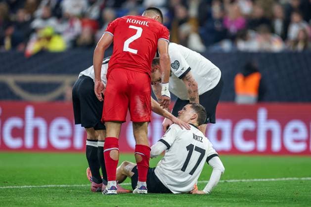 10 10 2025, Football, International match, Germany Luxembourg, UEFA World Cup Qualification, 2025 2026, Group A, PreZero Arena in Sinsheim Florian Wirtz GER 17 lies on the pitch in pain and requires medical attention DFB regulations prohibit any use of photographs as image sequences and or quasi video Baden Württemberg Germany
