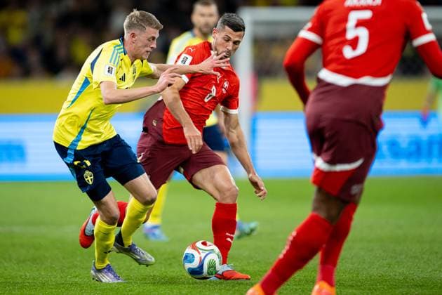 October 10, 2025, Solna, Sweden: Alexander Bernhardsson of Sweden and Remo Freuler of Switzerland seen in action during FIFA 2026 World Cup Qualifier Group B match between Sweden and Switzerland at Strawberry Arena in Solna, Sweden. Solna Sweden - ZUMAs227 20251010_zip_s227_003 Copyright: xMateuszxSlodkowskix