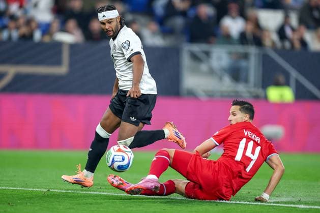 10 10 2025, Football, International match, Germany Luxembourg, UEFA World Cup Qualification, 2025 2026, Group A, PreZero Arena in Sinsheim Serge Gnabry GER 20 in duel against Eric Veiga LUX 14 Goal shot to 3 0 DFB regulations prohibit any use of photographs as image sequences and or quasi video Baden Württemberg Germany