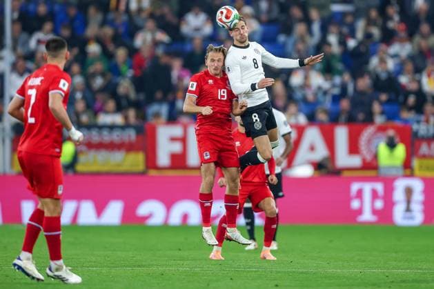 10 10 2025, Football, International match, Germany Luxembourg, UEFA World Cup Qualification, 2025 2026, Group A, PreZero Arena in Sinsheim Mathias Olesen LUX 19 in duel against Leon Goretzka GER 08 DFB regulations prohibit any use of photographs as image sequences and or quasi video Baden Württemberg Germany