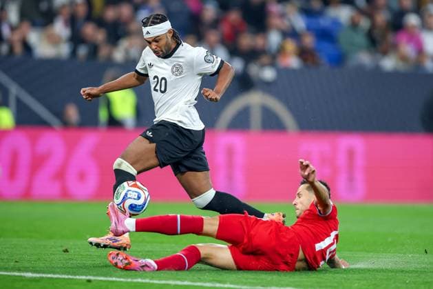 10 10 2025, Football, International match, Germany Luxembourg, UEFA World Cup Qualification, 2025 2026, Group A, PreZero Arena in Sinsheim Serge Gnabry GER 20 in duel against Eric Veiga LUX 14 Goal shot to 3 0 DFB regulations prohibit any use of photographs as image sequences and or quasi video Baden Württemberg Germany