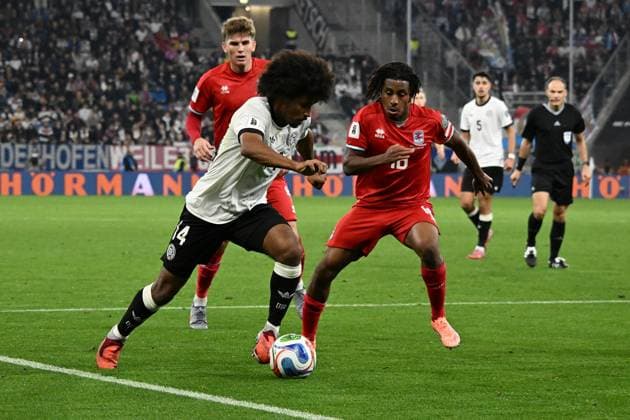 10 10 2025, xsltx, Football World Cup Qualification 2026, Germany Luxembourg v l Karim Adeyemi German National Football Team DFB Leandro Barreiro Luxembourg duel, action, action, battle for the ball DFL DFB REGULATIONS PROHIBIT ANY USE OF PHOTOGRAPHS as IMAGE SEQUENCES and or QUASI VIDEO Sinsheim