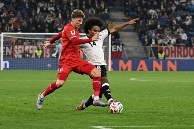 10 10 2025, xsltx, Football World Cup Qualification 2026, Germany Luxembourg v l Karim Adeyemi German National Football Team DFB Florian Bohnert Luxembourg duel, action, action, battle for the ball DFL DFB REGULATIONS PROHIBIT ANY USE OF PHOTOGRAPHS as IMAGE SEQUENCES and or QUASI VIDEO Sinsheim