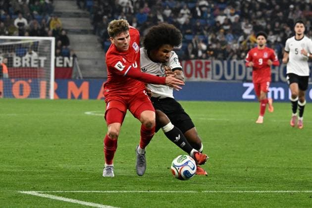 10 10 2025, xsltx, Football World Cup Qualification 2026, Germany Luxembourg v l Karim Adeyemi German National Football Team DFB Florian Bohnert Luxembourg duel, action, action, battle for the ball DFL DFB REGULATIONS PROHIBIT ANY USE OF PHOTOGRAPHS as IMAGE SEQUENCES and or QUASI VIDEO Sinsheim