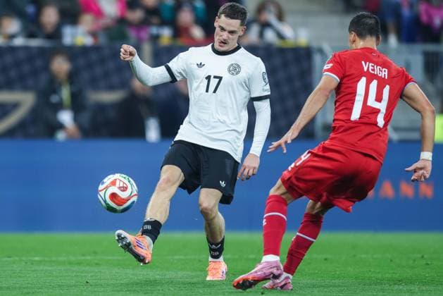 Soccer World Cup Qualification Germany Luxembourg on 10 10 2025 at the PreZero Arena in Sinsheim Florian Wirtz Germany , left Eric Veiga Luxembourg , right DFB regulations prohibit any use of photographs as image sequences and or quasi video xJRx