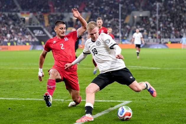 v li Seid Korac Luxembourg, 2 , Jonathan Burkardt Germany, 19 , duel, duel scene, duel, tackle, tackling, dynamics, action, action, 10 10 2025, Sinsheim Germany , football, World Cup qualification, Germany Luxembourg, THE EVENT REGULATIONS PROHIBIT ANY USE OF PHOTOGRAPHS AS IMAGE SEQUENCES AND OR QUASI VIDEOS xozx