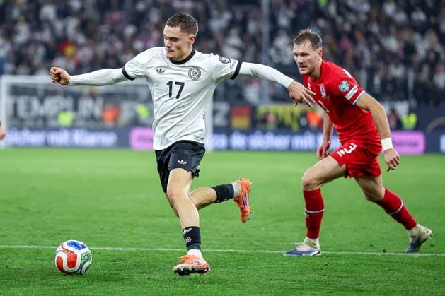 10 10 2025, Football, International match, Germany Luxembourg, UEFA World Cup Qualification, 2025 2026, Group A, PreZero Arena in Sinsheim Florian Wirtz GER 17 in duel against Enes Mahmutovic LUX 03 DFB regulations prohibit any use of photographs as image sequences and or quasi video Baden Württemberg Germany