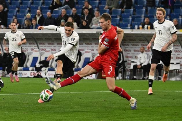10 10 2025, xsltx, Football World Cup Qualification 2026, Germany Luxembourg v l Florian Wirtz German National Football Team DFB Enes Mahmutovic Luxembourg duel, action, action, battle for the ball DFL DFB REGULATIONS PROHIBIT ANY USE OF PHOTOGRAPHS as IMAGE SEQUENCES and or QUASI VIDEO Sinsheim