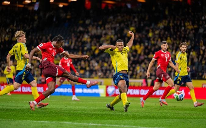 251010 Johan Manzamb of Switzerland scores the 0 2 goal against Isak Hien of Sweden during the FIFA World Cup Qualifier football match between Sweden and Switzerland on October 10, 2025 in Stockholm Photo Joel Marklund BILDBYRAN kod JM JM0740 bbeng fotboll football soccer fotball vm kval kval fifa world cup qualifier qualifier qualification sverige sweden sverige a schweiz switzerlandbbauto  Copyright: JOELxMARKLUND BB251010JM120