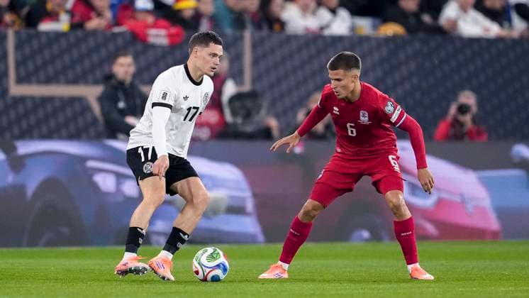 v li Florian Wirtz Germany, 17 , Tomas Moreira Luxembourg, 6 , Action, Action, Game scene, 10 10 2025, Sinsheim Germany , Soccer, World Cup Qualification, Germany Luxembourg, THE EVENT REGULATIONS PROHIBIT ANY USE OF PHOTOGRAPHS AS IMAGE SEQUENCES AND OR QUASI VIDEOS xozx