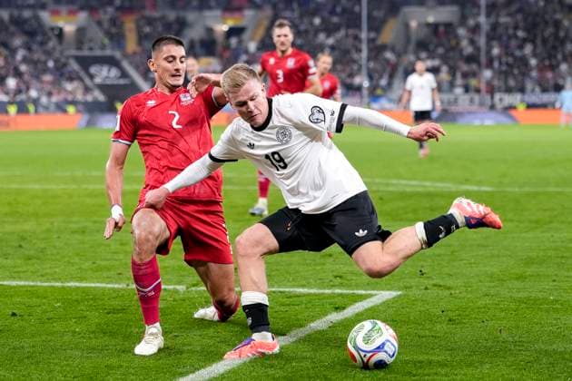 v li Seid Korac Luxembourg, 2 , Jonathan Burkardt Germany, 19 , duel, duel scene, duel, tackle, tackling, dynamics, action, action, 10 10 2025, Sinsheim Germany , football, World Cup qualification, Germany Luxembourg, THE EVENT REGULATIONS PROHIBIT ANY USE OF PHOTOGRAPHS AS IMAGE SEQUENCES AND OR QUASI VIDEOS xozx