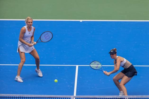 WUHAN, CHINA - OCTOBER 11: Storm Hunter of Australia and Katerina Siniakova of the Czech Republic return a shot in the Women s Doubles Semifinal match against Olivia Nicholls of Great Britain and Tereza Mihalikova of Slovakia on day 8 of 2025 Wuhan Open at Optics Valley International Tennis Center on October 11, 2025 in Wuhan, Hubei Province of China.  Copyright: xVCGx 111596554009