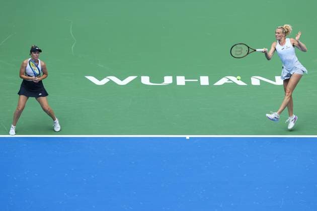 WUHAN, CHINA - OCTOBER 11: Storm Hunter of Australia and Katerina Siniakova of the Czech Republic return a shot in the Women s Doubles Semifinal match against Olivia Nicholls of Great Britain and Tereza Mihalikova of Slovakia on day 8 of 2025 Wuhan Open at Optics Valley International Tennis Center on October 11, 2025 in Wuhan, Hubei Province of China.  Copyright: xVCGx 111596553917