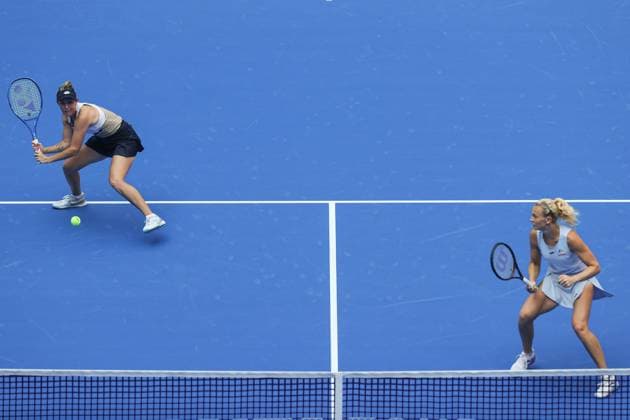 WUHAN, CHINA - OCTOBER 11: Storm Hunter of Australia and Katerina Siniakova of the Czech Republic return a shot in the Women s Doubles Semifinal match against Olivia Nicholls of Great Britain and Tereza Mihalikova of Slovakia on day 8 of 2025 Wuhan Open at Optics Valley International Tennis Center on October 11, 2025 in Wuhan, Hubei Province of China.  Copyright: xVCGx 111596553923