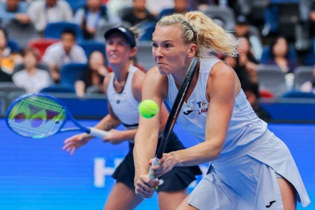 WUHAN, CHINA - OCTOBER 11: Storm Hunter of Australia and Katerina Siniakova of the Czech Republic return a shot in the Women s Doubles Semifinal match against Olivia Nicholls of Great Britain and Tereza Mihalikova of Slovakia on day 8 of 2025 Wuhan Open at Optics Valley International Tennis Center on October 11, 2025 in Wuhan, Hubei Province of China.  Copyright: xVCGx 111596553888