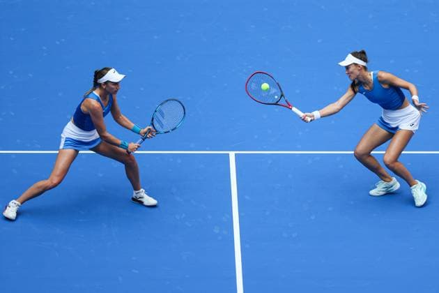 WUHAN, CHINA - OCTOBER 11: Olivia Nicholls of Great Britain and Tereza Mihalikova of Slovakia return a shot in the Women s Doubles Semifinal match against Storm Hunter of Australia and Katerina Siniakova of the Czech Republic on day 8 of 2025 Wuhan Open at Optics Valley International Tennis Center on October 11, 2025 in Wuhan, Hubei Province of China.  Copyright: xVCGx 111596553908