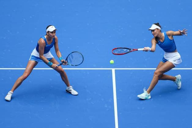 WUHAN, CHINA - OCTOBER 11: Olivia Nicholls of Great Britain and Tereza Mihalikova of Slovakia return a shot in the Women s Doubles Semifinal match against Storm Hunter of Australia and Katerina Siniakova of the Czech Republic on day 8 of 2025 Wuhan Open at Optics Valley International Tennis Center on October 11, 2025 in Wuhan, Hubei Province of China.  Copyright: xVCGx 111596553909