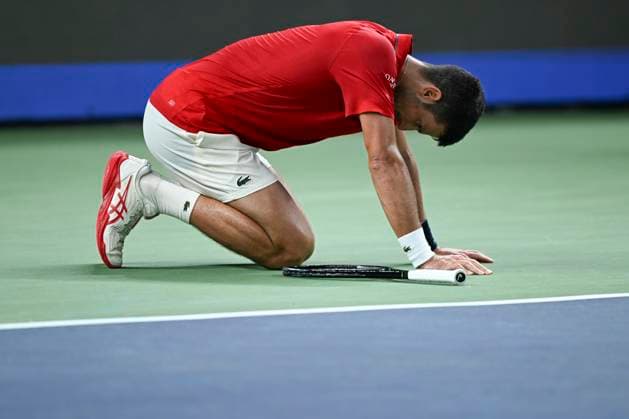 (251011) -- SHANGHAI, Oct. 11, 2025 -- Novak Djokovic knees on the court during the men s singles semifinal between Novak Djokovic of Serbia and Valentin Vacherot of Monaco at the ATP, Tennis Herren World Tour Shanghai Masters tennis tournament in Shanghai, east China, Oct. 11, 2025. ) (SP)CHINA-SHANGHAI-TENNIS-ATP TOUR-SHANGHAI MASTERS-MEN S SINGLES (CN) ChenxHaoming 