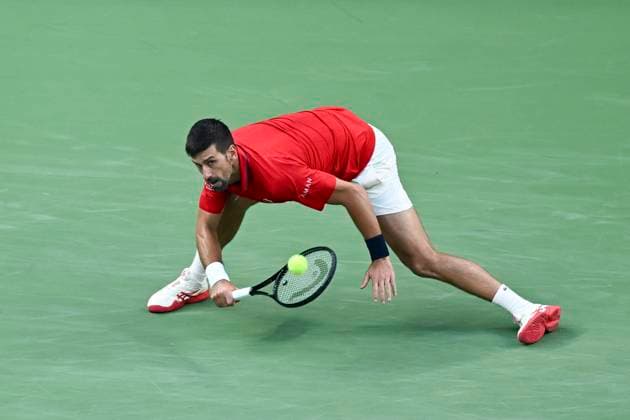 (251011) -- SHANGHAI, Oct. 11, 2025 -- Novak Djokovic hits a return during the men s singles semifinal between Novak Djokovic of Serbia and Valentin Vacherot of Monaco at the ATP, Tennis Herren World Tour Shanghai Masters tennis tournament in Shanghai, east China, Oct. 11, 2025. ) (SP)CHINA-SHANGHAI-TENNIS-ATP TOUR-SHANGHAI MASTERS-MEN S SINGLES (CN) ChenxHaoming 