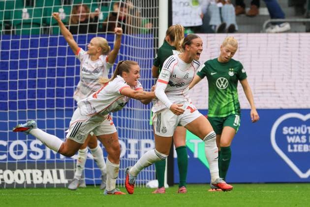 Wolfsburg, Germany 11 October 2025 1 BL Women 2025 2026 VfL Wolfsburg vs FC Bayern Munich In the picture from left the second goal scorer Klara Bühl Buehl FCB makes the goal to 1 0 for FC Bayern and cheers with Georgia Stanway FCB DFB regulations prohibit any use of photographs as image sequences and or quasi video AOK Stadion Niedersachsen Copyright: xFotostandx xFantinix
