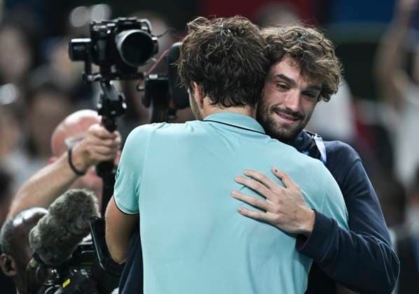 (251011) -- SHANGHAI, Oct. 11, 2025 -- Arthur Rinderknech hugs Valentin Vacherot of Monaco after the men s singles semifinal between Arthur Rinderknech of France and Daniil Medvedev of Russia at the ATP, Tennis Herren World Tour Shanghai Masters tennis tournament in Shanghai, east China, Oct. 11, 2025. ) (SP)CHINA-SHANGHAI-TENNIS-ATP TOUR-SHANGHAI MASTERS-MEN S SINGLES (CN) ChenxHaoming 