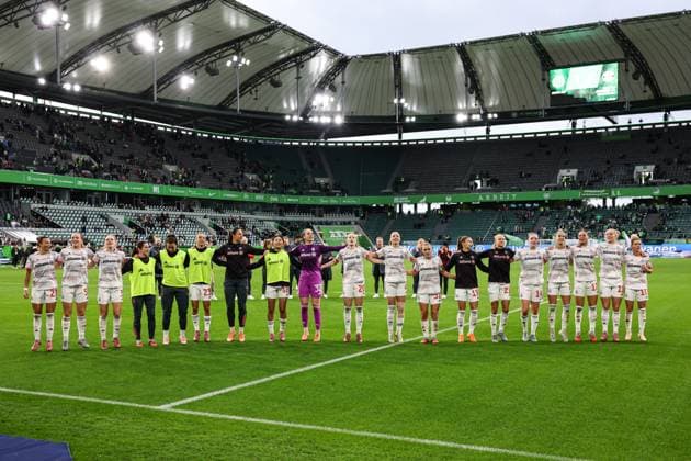 The FC Bayern Munich team celebrates the victory in front of the fan block Google Pixel Womens Bundesliga Season 2025 2026 VfL Wolfsburg vs FC Bayern Munich at the Volkswagen Arena in Wolfsburg Action,Football,Woman,Women,Ladies,Germany,11 10 2025