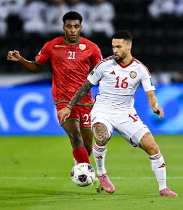 UNITED ARAB EMIRATES v OMAN-2026 FIFA World Cup, WM, Weltmeisterschaft, Fussball ASIAN QUALIFIER PLAYOFFS Marcus Vinicius (R) of United Arab Emirates and Abdul Rahman Al Mushaifri of Oman in action during the FIFA World Cup 2026 AFC Asian qualifiers playoffs group A match between United Arab Emirates and Oman at Jassim Bin Hamad Stadium in Doha, Qatar, on October 11, 2025. DOHA Qatar Copyright: xNOUSHADx