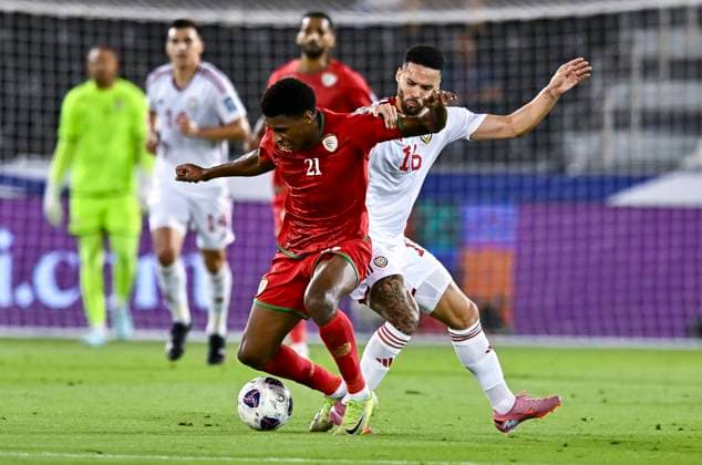 UNITED ARAB EMIRATES v OMAN-2026 FIFA World Cup, WM, Weltmeisterschaft, Fussball ASIAN QUALIFIER PLAYOFFS Marcus Vinicius (R) of United Arab Emirates and Abdul Rahman Al Mushaifri of Oman in action during the FIFA World Cup 2026 AFC Asian qualifiers playoffs group A match between United Arab Emirates and Oman at Jassim Bin Hamad Stadium in Doha, Qatar, on October 11, 2025. DOHA Qatar Copyright: xNOUSHADx